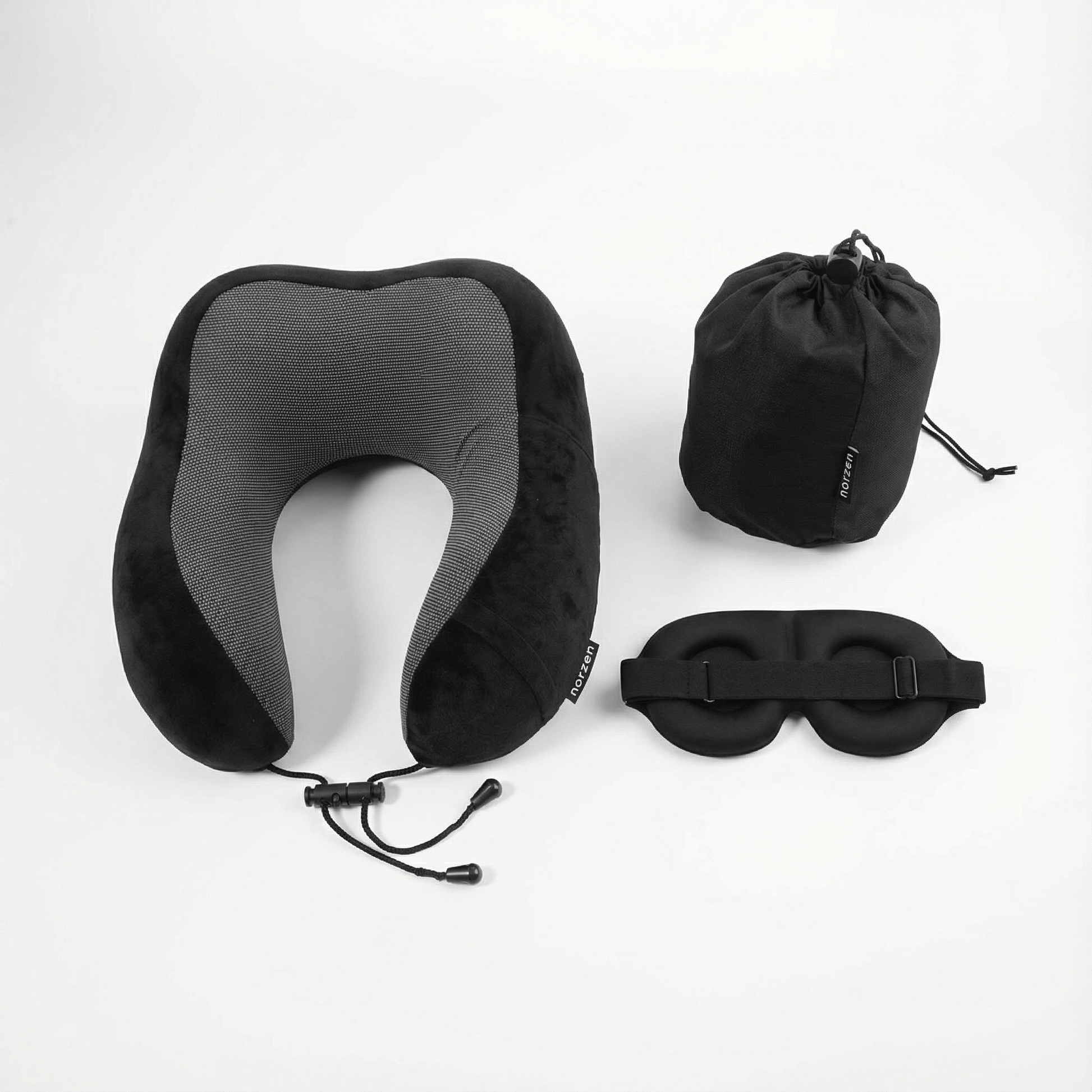 Sort NORZEN reisesett bestående av ergonomisk nakkepute, sovemaske og oppbevaringspose for komfortabel søvn på reise